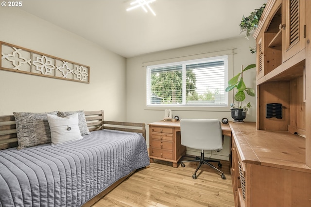 bedroom with light wood finished floors