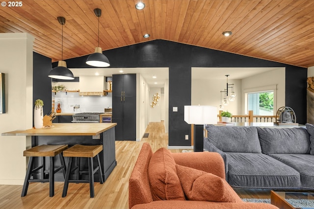 living room with light wood-style floors, recessed lighting, baseboards, vaulted ceiling, and wood ceiling