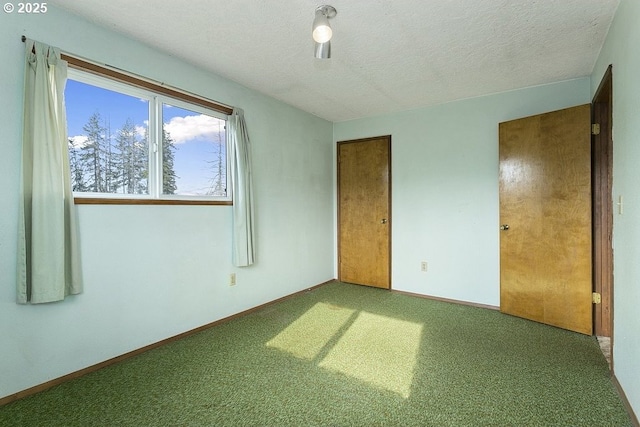 unfurnished bedroom featuring a closet, carpet, and a textured ceiling