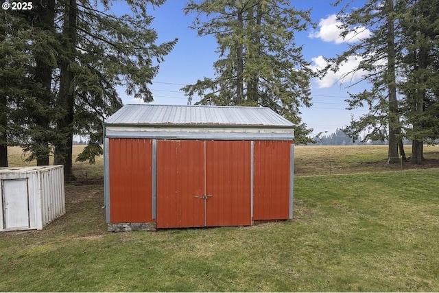 view of outdoor structure with a yard