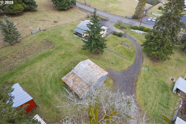 birds eye view of property with a rural view