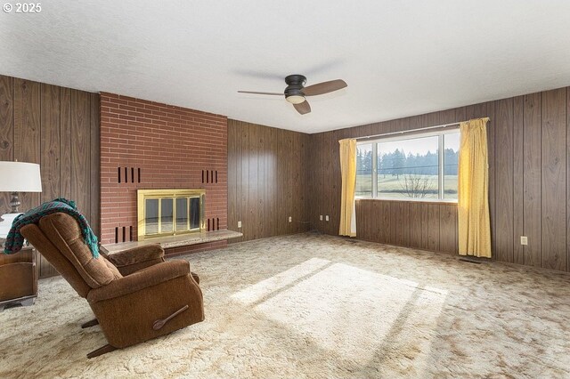 unfurnished room with ceiling fan, light colored carpet, and a textured ceiling