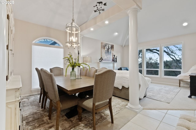 dining area with plenty of natural light, vaulted ceiling, and ornate columns