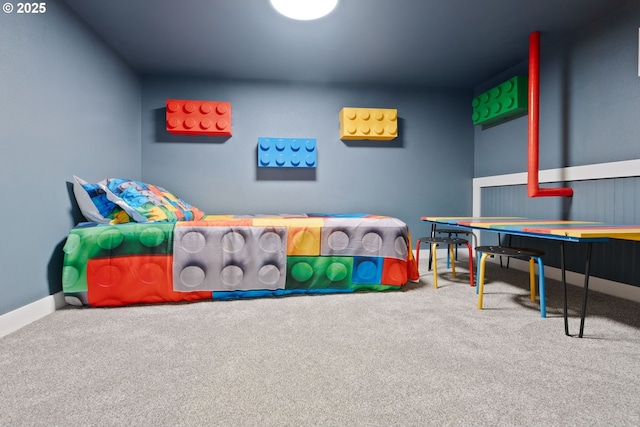 carpeted bedroom featuring baseboards