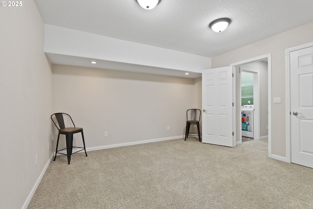 interior space with carpet floors, recessed lighting, a textured ceiling, and baseboards