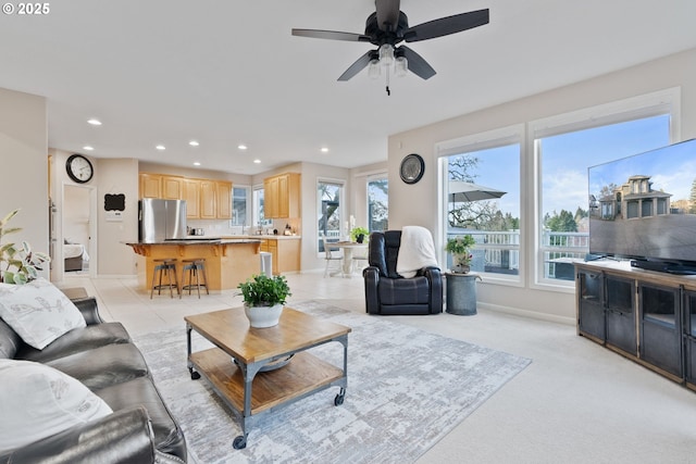 living room featuring a ceiling fan, recessed lighting, light tile patterned flooring, and baseboards