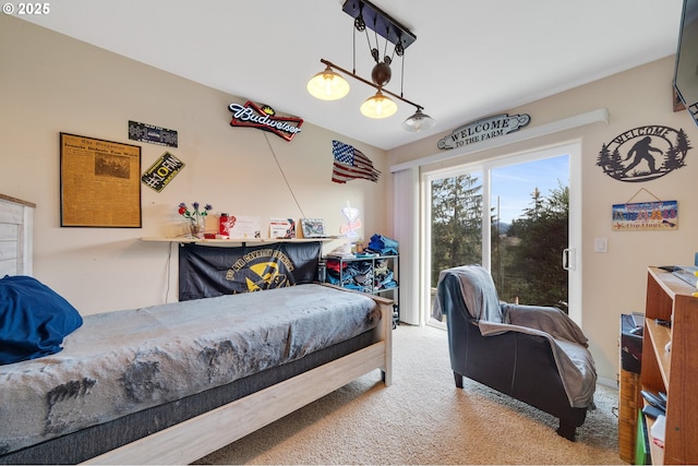 carpeted bedroom featuring access to outside