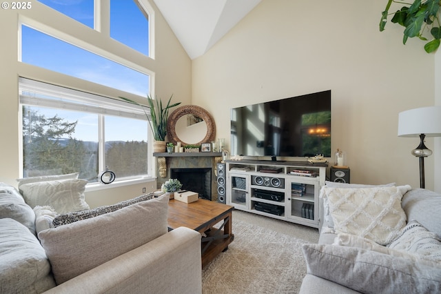 living room featuring high vaulted ceiling and light carpet