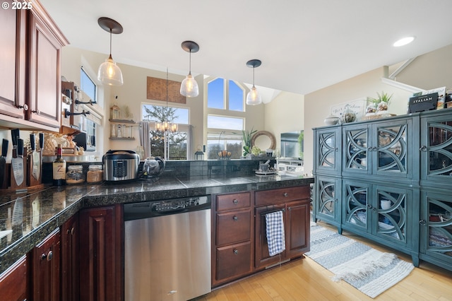 kitchen with pendant lighting, a notable chandelier, light hardwood / wood-style flooring, and stainless steel dishwasher