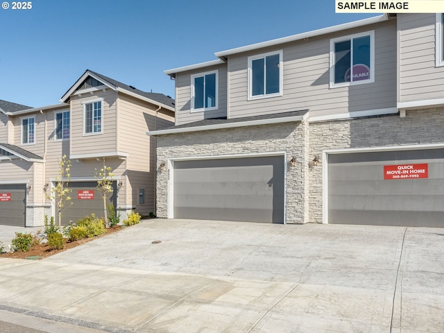 846 NW 178th Way, Ridgefield, WA 98642 - view of front facade featuring stone siding, a garage, and driveway