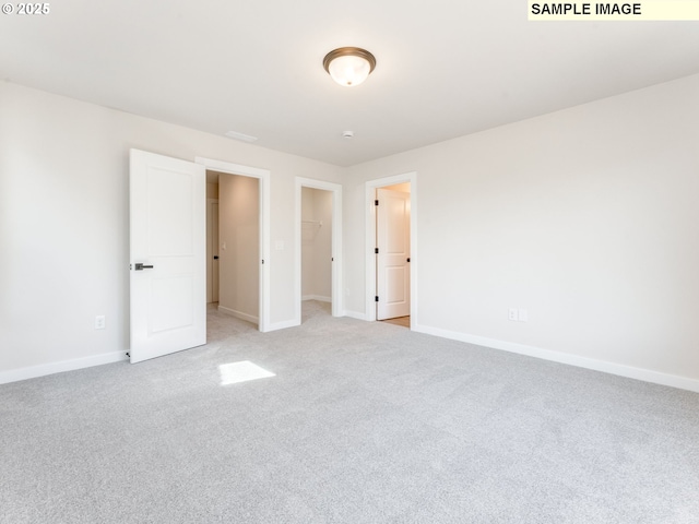846 NW 178th Way, Ridgefield, WA 98642 - unfurnished bedroom featuring light colored carpet and a walk in closet