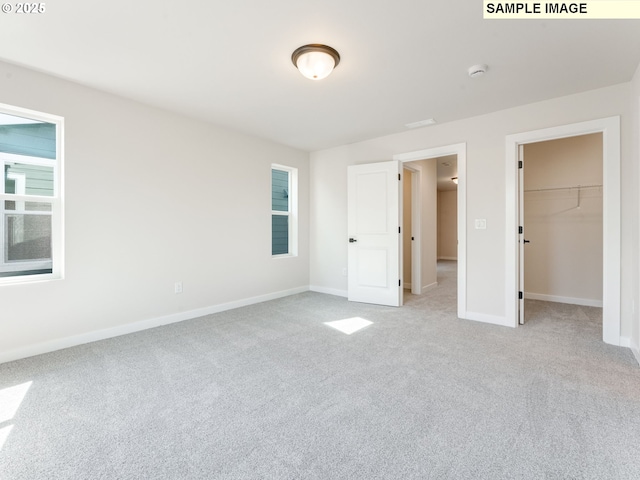 846 NW 178th Way, Ridgefield, WA 98642 - unfurnished bedroom with light colored carpet, a walk in closet, and a closet