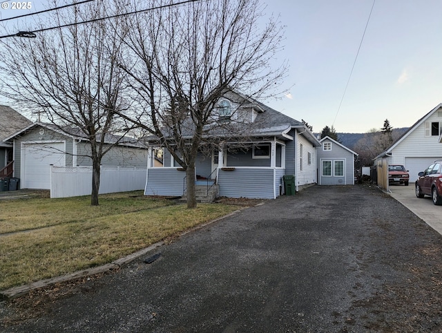 view of front facade with a front lawn and a garage