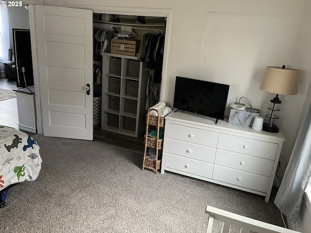 carpeted bedroom with a closet