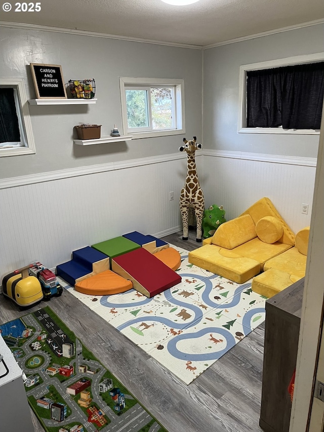 bedroom featuring hardwood / wood-style flooring and ornamental molding