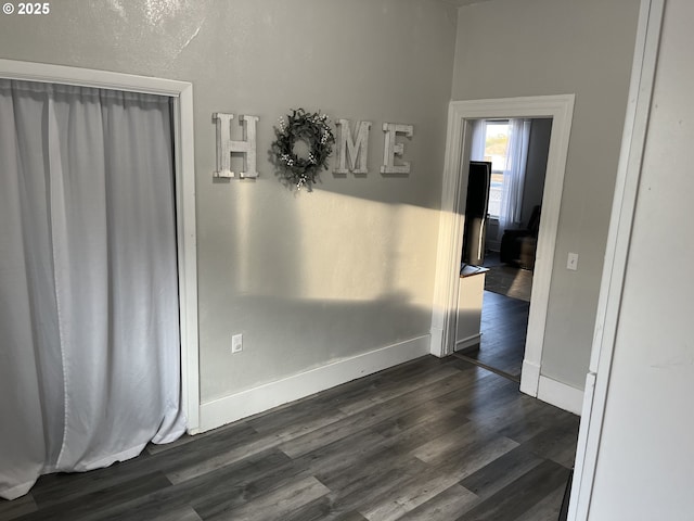 spare room with dark wood-type flooring