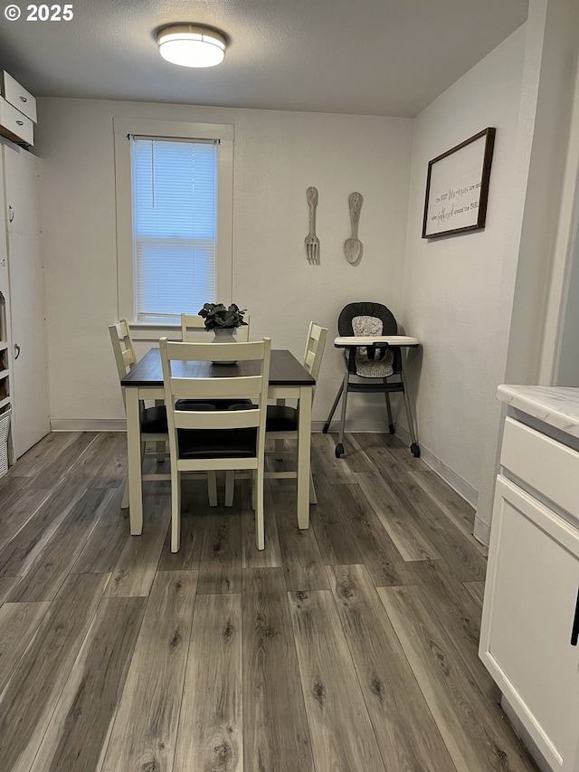 dining area featuring dark hardwood / wood-style flooring