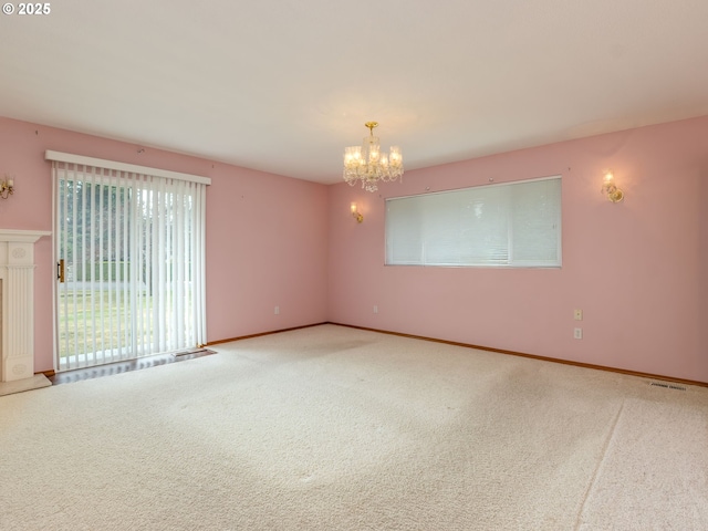 1218 SE Single Tree Dr, Vancouver, WA 98683 - carpeted empty room with a chandelier and baseboards