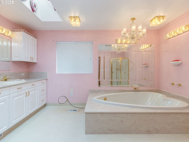 1218 SE Single Tree Dr, Vancouver, WA 98683 - full bath featuring vanity, a garden tub, a chandelier, and a skylight
