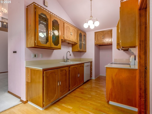 1218 SE Single Tree Dr, Vancouver, WA 98683 - kitchen with a chandelier, white dishwasher, light countertops, light wood-type flooring, and brown cabinetry
