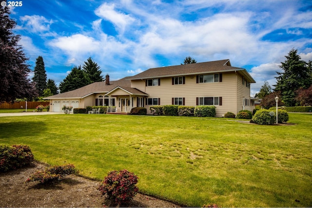 1218 SE Single Tree Dr, Vancouver, WA 98683 - view of front facade featuring an attached garage, concrete driveway, a front yard, and a chimney