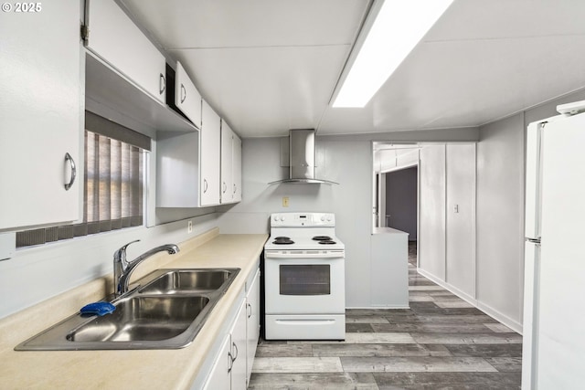 kitchen featuring sink, white appliances, dark hardwood / wood-style floors, white cabinets, and wall chimney exhaust hood