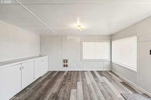 empty room with dark wood-type flooring