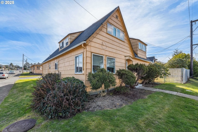 view of side of property featuring a yard