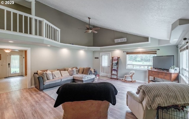 11885 Riverhaven Ln SE, Stayton, OR 97383 - living room with a ceiling fan, healthy amount of natural light, wood finished floors, a textured ceiling, and high vaulted ceiling