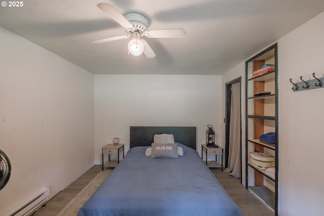 11885 Riverhaven Ln SE, Stayton, OR 97383 - bedroom with a baseboard radiator, light wood-type flooring, and ceiling fan