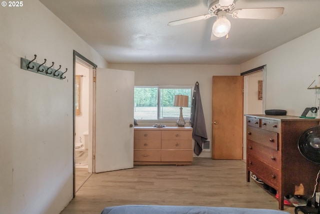 11885 Riverhaven Ln SE, Stayton, OR 97383 - bedroom featuring light wood-style flooring, ensuite bath, and ceiling fan