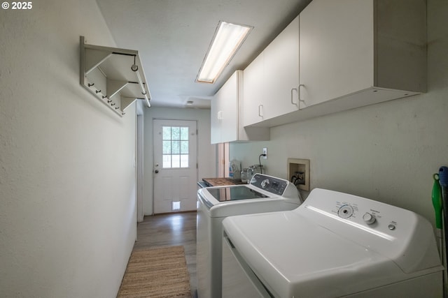 11885 Riverhaven Ln SE, Stayton, OR 97383 - laundry area featuring washer and dryer, cabinet space, and light wood-type flooring