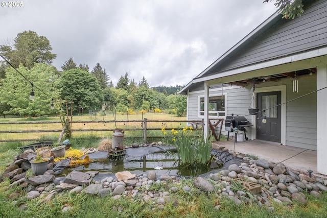 11885 Riverhaven Ln SE, Stayton, OR 97383 - view of yard with a small pond, fence, and a patio area