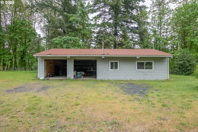 11885 Riverhaven Ln SE, Stayton, OR 97383 - back of house with a garage, metal roof, and a yard