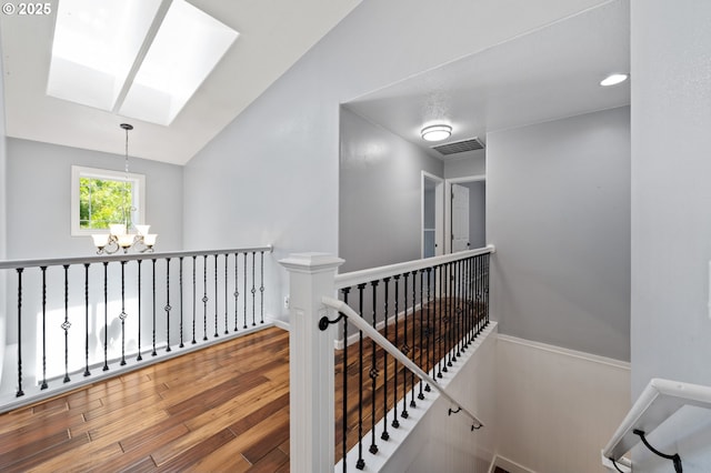 3541 SW Wonderview Ave, Gresham, OR 97080 - corridor featuring an upstairs landing, a skylight, a chandelier, and wood finished floors