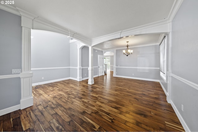 3541 SW Wonderview Ave, Gresham, OR 97080 - unfurnished room featuring a chandelier, arched walkways, ornamental molding, wood finished floors, and baseboards