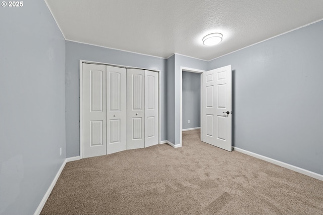 3541 SW Wonderview Ave, Gresham, OR 97080 - unfurnished bedroom with carpet, a textured ceiling, a closet, and baseboards