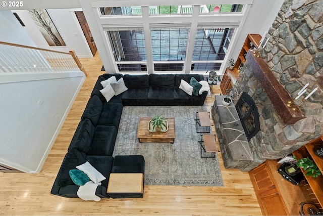 20015 NE 234th St, Battle Ground, WA 98604 - living area with wood finished floors, baseboards, and a stone fireplace