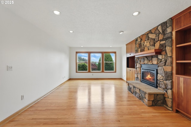 1324 Stonehaven Dr, West Linn, OR 97068 - unfurnished living room with light wood-style floors, a fireplace, recessed lighting, and baseboards