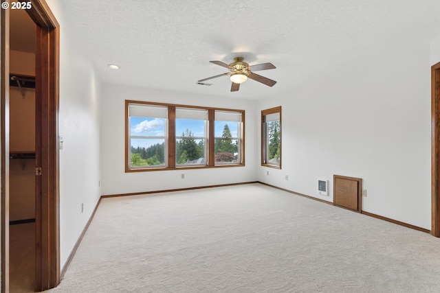 1324 Stonehaven Dr, West Linn, OR 97068 - carpeted spare room with a ceiling fan, baseboards, a textured ceiling, and recessed lighting