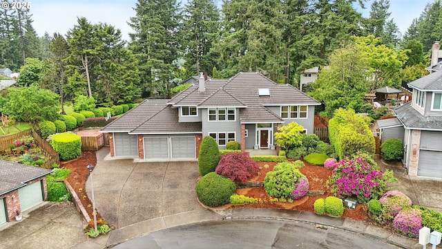 1324 Stonehaven Dr, West Linn, OR 97068 - traditional-style house featuring a tiled roof, driveway, and an attached garage
