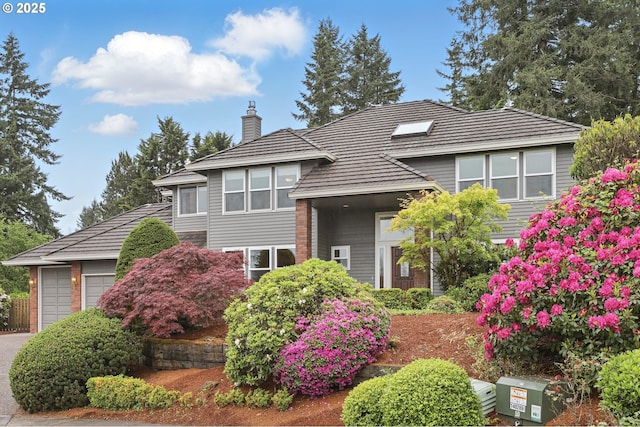 1324 Stonehaven Dr, West Linn, OR 97068 - view of front of house with a chimney, a garage, and asphalt driveway