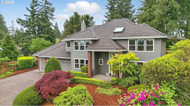1324 Stonehaven Dr, West Linn, OR 97068 - view of front of house with a chimney, driveway, and an attached garage