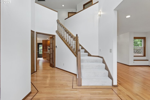 1324 Stonehaven Dr, West Linn, OR 97068 - stairs with plenty of natural light, wood finished floors, recessed lighting, and baseboards