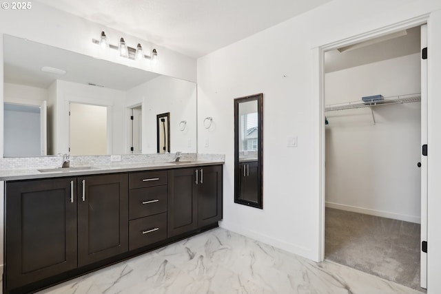 bathroom with vanity and backsplash