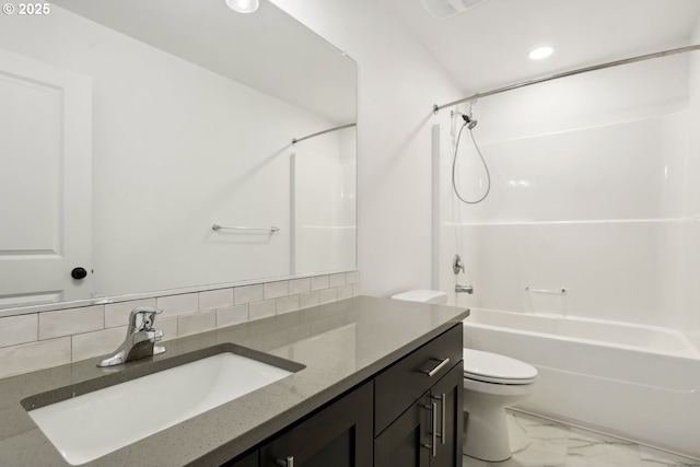 full bathroom featuring vanity, backsplash, shower / bathtub combination, and toilet