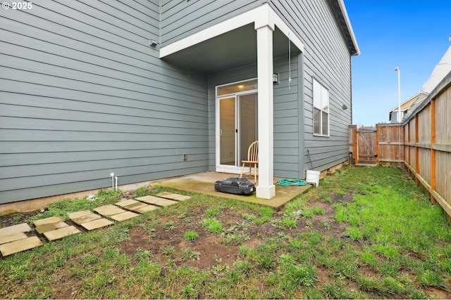 back of house with a patio