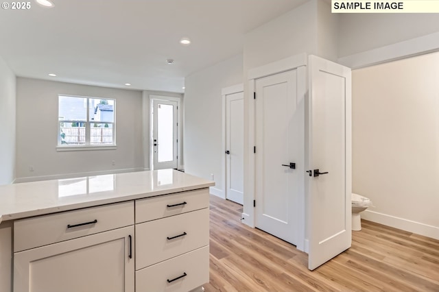 7762 SW Bonita Blvd, Tigard, OR 97224 - hallway with light wood finished floors, recessed lighting, and baseboards