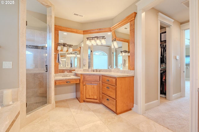 21106 NW 3rd Ct, Ridgefield, WA 98642 - bathroom featuring a shower stall, a walk in closet, and vanity