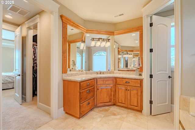 21106 NW 3rd Ct, Ridgefield, WA 98642 - full bathroom featuring vanity, connected bathroom, a spacious closet, and tile patterned floors